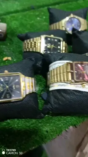 Elegant Gold Metal Watch with Black Face